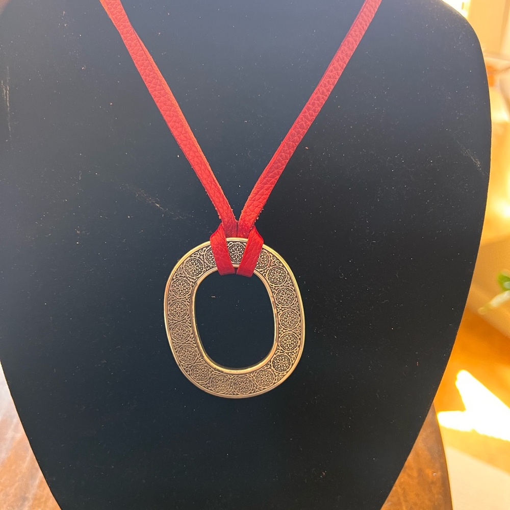 Elegant Silver Pendant Necklace with Red Cord